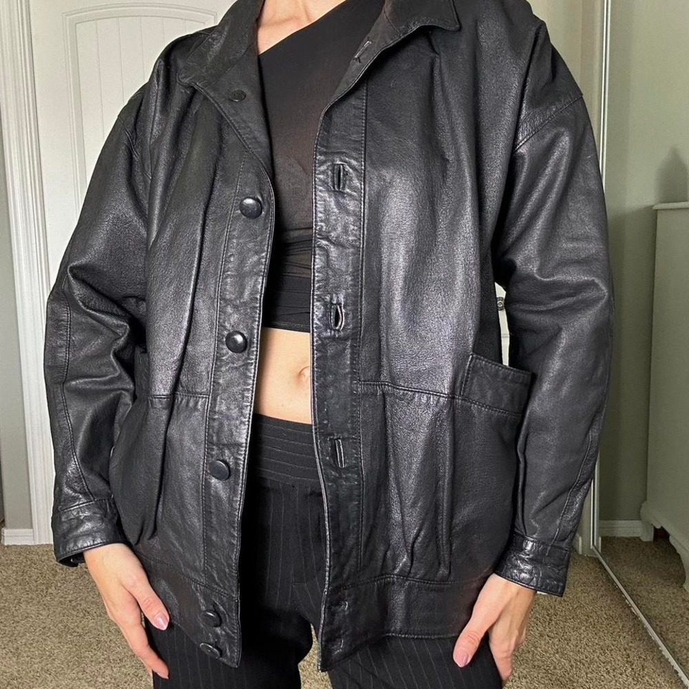 Black leather jacket with a boxy bomber fit